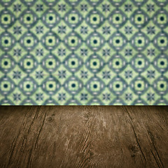 Image showing Wood table top and blur vintage ceramic tile pattern wall