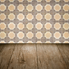 Image showing Wood table top and blur vintage ceramic tile pattern wall