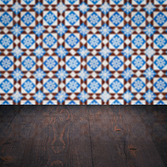 Image showing Wood table top and blur vintage ceramic tile pattern wall