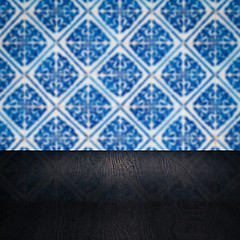 Image showing Wood table top and blur vintage ceramic tile pattern wall