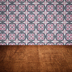 Image showing Wood table top and blur vintage ceramic tile pattern wall