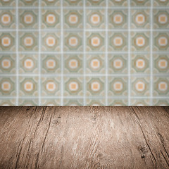 Image showing Wood table top and blur vintage ceramic tile pattern wall