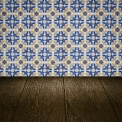 Image showing Wood table top and blur vintage ceramic tile pattern wall