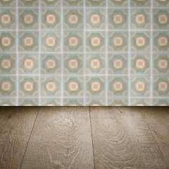 Image showing Wood table top and blur vintage ceramic tile pattern wall