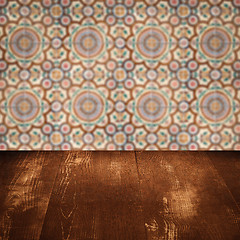 Image showing Wood table top and blur vintage ceramic tile pattern wall