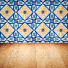 Image showing Wood table top and blur vintage ceramic tile pattern wall