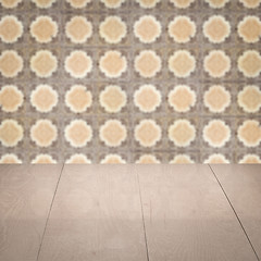 Image showing Wood table top and blur vintage ceramic tile pattern wall