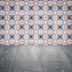 Image showing Wood table top and blur vintage ceramic tile pattern wall