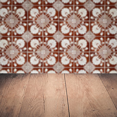 Image showing Wood table top and blur vintage ceramic tile pattern wall