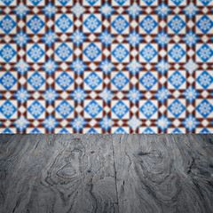 Image showing Wood table top and blur vintage ceramic tile pattern wall