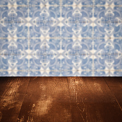 Image showing Wood table top and blur vintage ceramic tile pattern wall