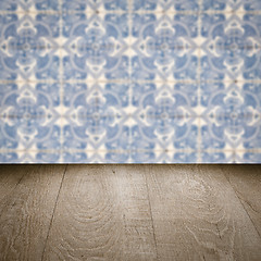 Image showing Wood table top and blur vintage ceramic tile pattern wall