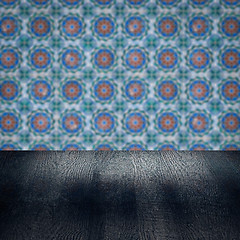 Image showing Wood table top and blur vintage ceramic tile pattern wall