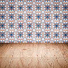 Image showing Wood table top and blur vintage ceramic tile pattern wall