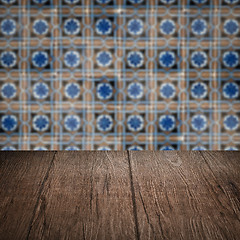 Image showing Wood table top and blur vintage ceramic tile pattern wall