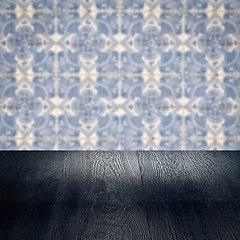 Image showing Wood table top and blur vintage ceramic tile pattern wall