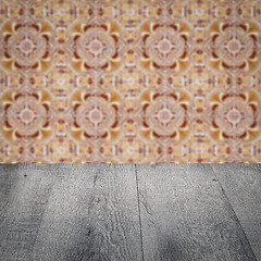 Image showing Wood table top and blur vintage ceramic tile pattern wall