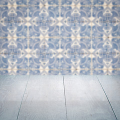 Image showing Wood table top and blur vintage ceramic tile pattern wall