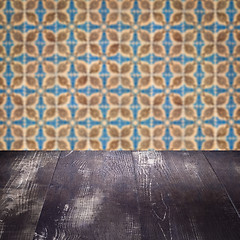 Image showing Wood table top and blur vintage ceramic tile pattern wall