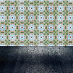 Image showing Wood table top and blur vintage ceramic tile pattern wall