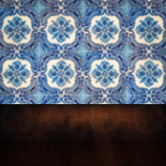 Image showing Wood table top and blur vintage ceramic tile pattern wall