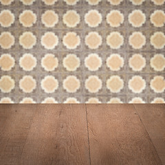 Image showing Wood table top and blur vintage ceramic tile pattern wall