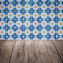 Image showing Wood table top and blur vintage ceramic tile pattern wall