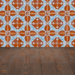 Image showing Wood table top and blur vintage ceramic tile pattern wall