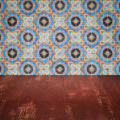 Image showing Wood table top and blur vintage ceramic tile pattern wall