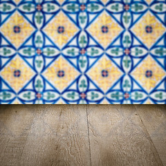 Image showing Wood table top and blur vintage ceramic tile pattern wall