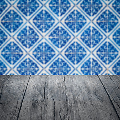 Image showing Wood table top and blur vintage ceramic tile pattern wall