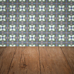 Image showing Wood table top and blur vintage ceramic tile pattern wall