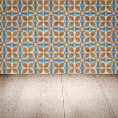 Image showing Wood table top and blur vintage ceramic tile pattern wall