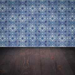 Image showing Wood table top and blur vintage ceramic tile pattern wall