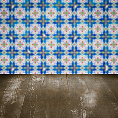 Image showing Wood table top and blur vintage ceramic tile pattern wall