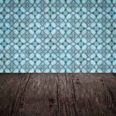 Image showing Wood table top and blur vintage ceramic tile pattern wall