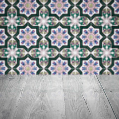 Image showing Wood table top and blur vintage ceramic tile pattern wall