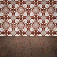 Image showing Wood table top and blur vintage ceramic tile pattern wall