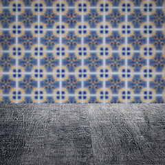 Image showing Wood table top and blur vintage ceramic tile pattern wall