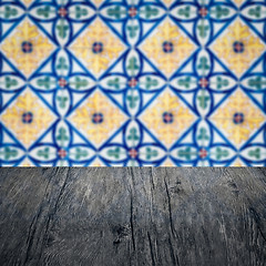 Image showing Wood table top and blur vintage ceramic tile pattern wall