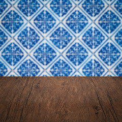 Image showing Wood table top and blur vintage ceramic tile pattern wall