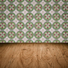 Image showing Wood table top and blur vintage ceramic tile pattern wall