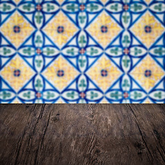 Image showing Wood table top and blur vintage ceramic tile pattern wall