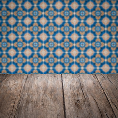 Image showing Wood table top and blur vintage ceramic tile pattern wall