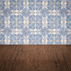 Image showing Wood table top and blur vintage ceramic tile pattern wall