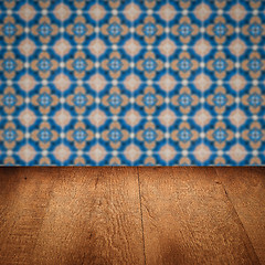 Image showing Wood table top and blur vintage ceramic tile pattern wall