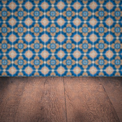 Image showing Wood table top and blur vintage ceramic tile pattern wall