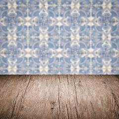 Image showing Wood table top and blur vintage ceramic tile pattern wall