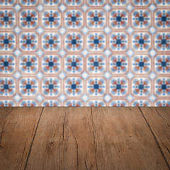 Image showing Wood table top and blur vintage ceramic tile pattern wall