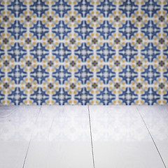 Image showing Wood table top and blur vintage ceramic tile pattern wall